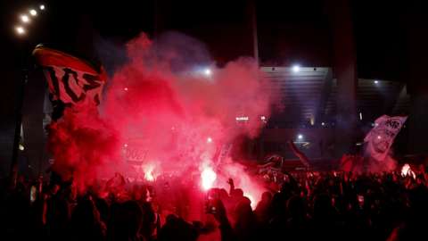 PSG fans celebrate outside stadium