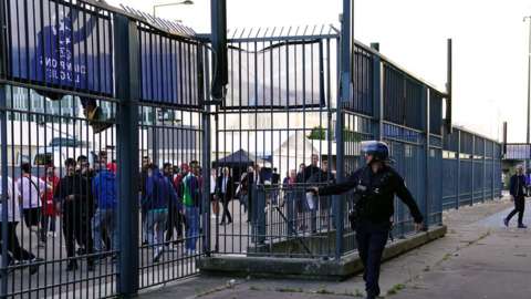 Police using pepper spray outside Paris stadium