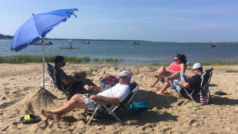 Zoe Fishman and family sunbathe on Cape Cod