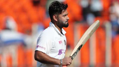 India batsman Rishabh Pant raises his bat to the crowd after being dismissed for 101 on day two of the final Test against England