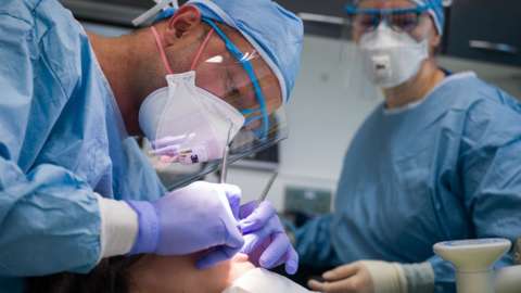 Image of a dentist at work