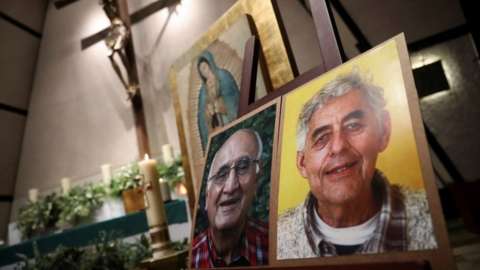Photos of two priests Javier Campos and Joaquin Mora who were murdered, are pictured during a mass