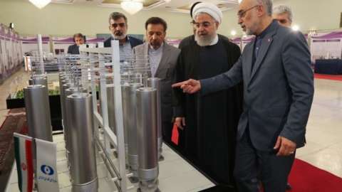 Former Iranian President Hassan Rouhani inspects nuclear technology in Tehran