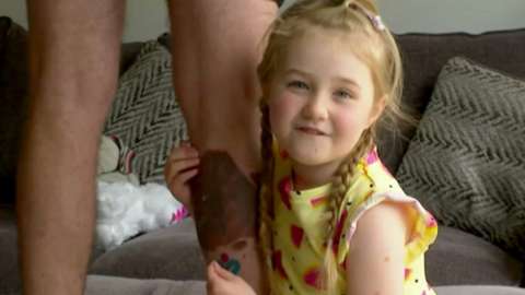 Isla with her dad's tattoo