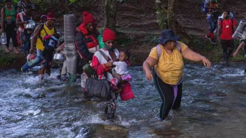 Haitian migrants crossing the Panama-Colombia border