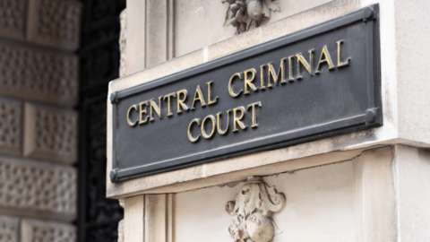 Central Criminal Court sign on the Old Bailey building