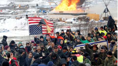 Opponents of the Dakota Access oil pipeline march out of their main camp near Cannon Ball, North Dakota