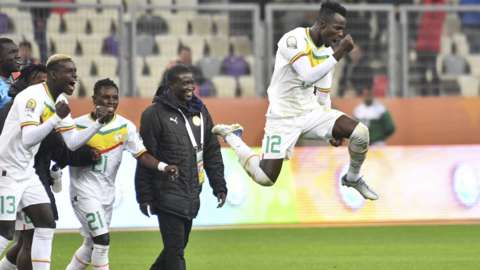 Senegal's players celebrate winning the CHAN semi-final