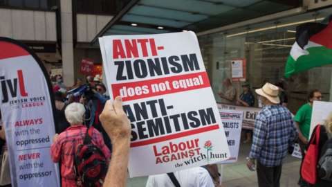 Supporters of Jewish Voice for Labour protest outside the party's headquarters in London in July 2021
