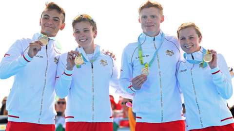 England's mixed relay team celebrate winning gold
