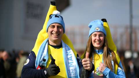 Man City fans arrive at the game