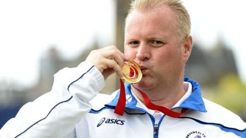 Darren Burnett celebrates his medal success at Glasgow 2014