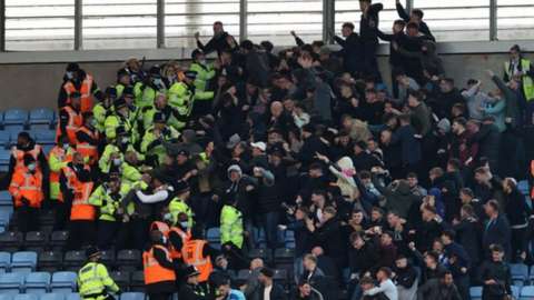 Scuffles between police and football fans