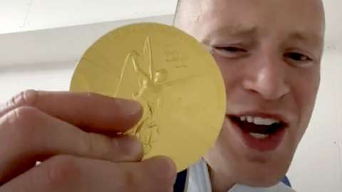 Swimmer Adam Peaty flashing his gold on TikTok