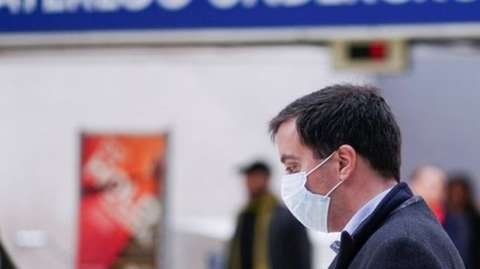 Man wearing mask on London Underground