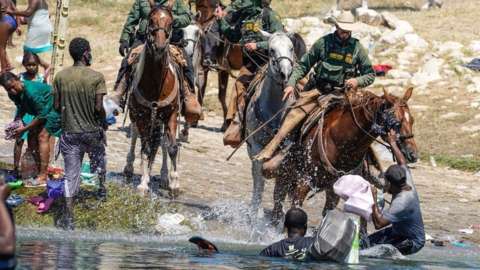 Image shows Border Patrol agents on horseback