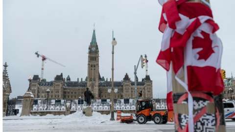 City employees clean up Wellington Street in front of Parliament Hill in Ottawa