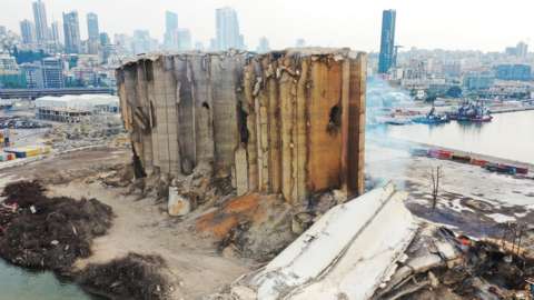 File photo showing smoke rising from a newly collapsed part of the Beirut grain silos, which were partially destroyed by the 4 August 2020 explosion (4 August 2022)