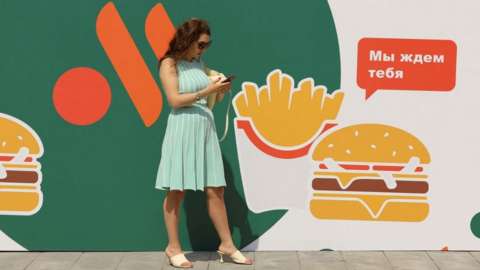Woman at rebranded McDonald's in Moscow, 12 Jun 22