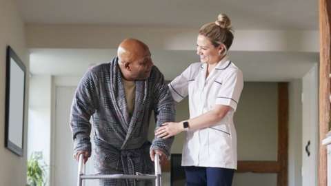 Care worker helping patient