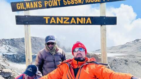 Martin Hibbert as he reaches Gilmans Point summit on the mountain