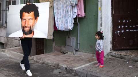 Turkish artist Ates Alpar took a portrait of Osman Kavala around Istanbul to highlight his four years in jail