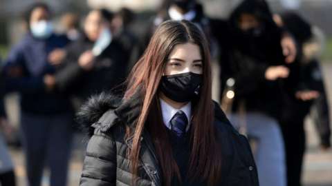 school pupil with face mask