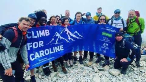 The Climb For Caroline team at the top of a peak