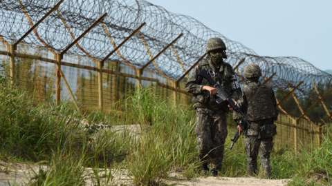 South Korean soldiers patrol at the North Korean border, 10 August 2015