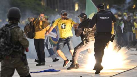 Protesters and police officers clash in Brazil