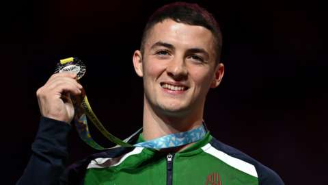Rhys McClenaghan said he had "mixed emotions" after having to settle for silver four years after winning gold at the last Commonwealth Games