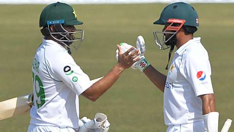 Pakistan's Azhar Ali and Babar Azam celebrate beating Bangladesh