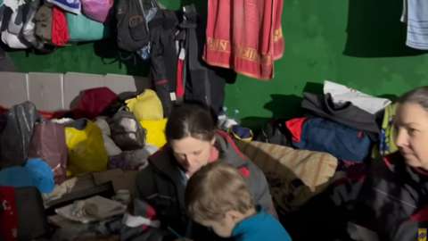 Women and children in an underground shelter in Azov's video
