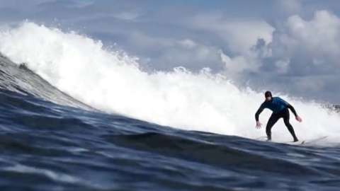Harry Cromwell surfing