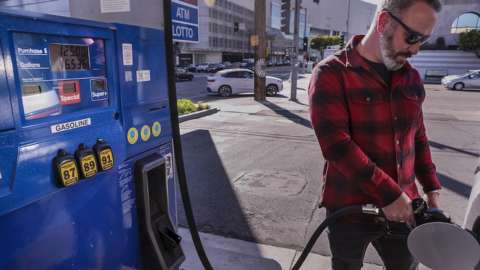 Man filling tank in California