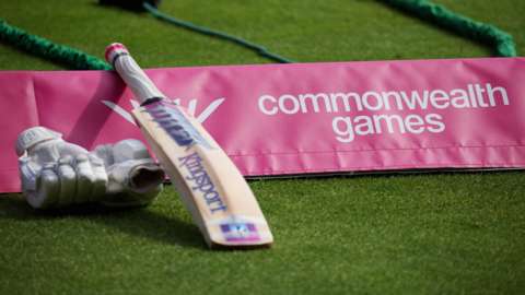A bat next to the Commonwealth Games logo