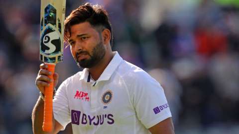 India batter Rishabh Pant raises his bat to the crowd after being dismissed