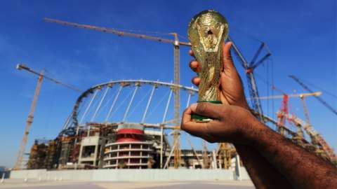 A replica of the FIFA World Cup trophy in front of the National Stadium, Qatar.