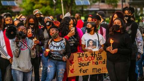 Protesters at a 2020 vigil for Breonna Taylor