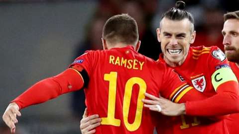 Gareth Bale celebrates Aaron Ramsey's opening goal against Belarus