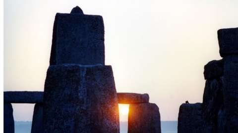 Sunrise seen through Stonehenge