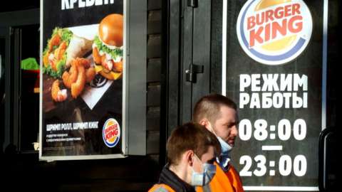 People outside a Burger King restaurant in Russia.