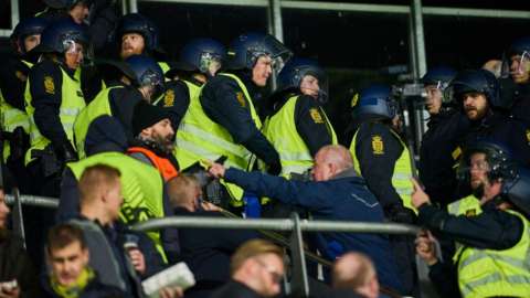 police and stewards inside stadium