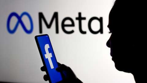 Facebook on phone with Meta logo