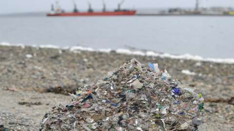 A pile of plastic on a beach