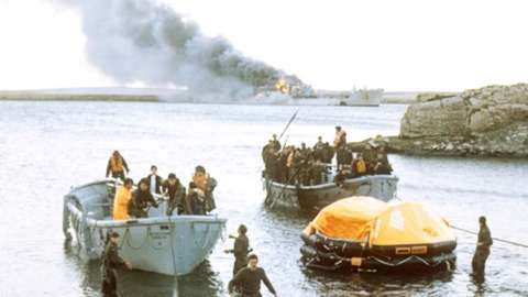 Survivors coming ashore from bombed Sir Galahad