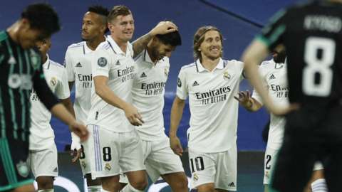 Real Madrid's Marco Asensio celebrates scoring their third goal with Toni Kroos
