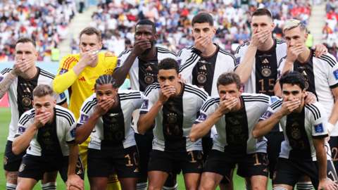 Germany team with hands over mouths