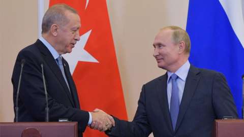 Russian President Vladimir Putin shakes hands with Turkish President Tayyip Erdogan during a news conference following their talks in Sochi, Russia October 22, 2019