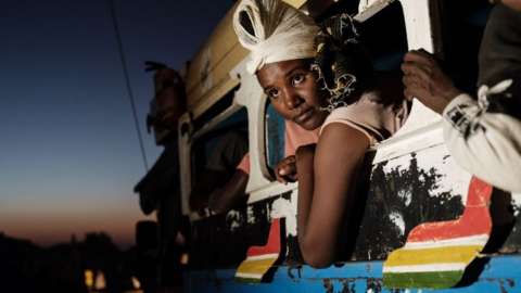 Ethiopian refugees who fled Ethiopia's Tigray conflict arrive by bus in Sudan - 11 December 2020